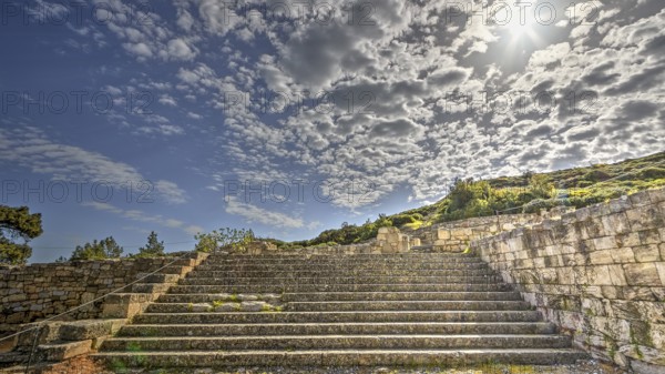 Stone staircase in an ancient ruin under a sunny sky with clouds, historical site, Kamiros, archaeological site, ancient city, foundation of Doric Greeks, Rhodes, Dodecanese, Greek Islands, Greece, Europe