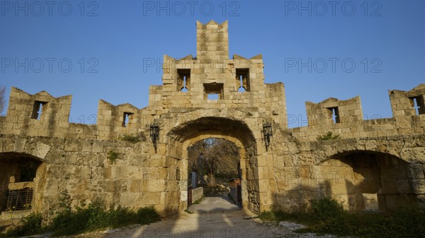 Ancient stone gate of a ruin with clear blue sky in the background, Tor Tor of Saint Paul, harbour area, Rhodes Town, Rhodes, Dodecanese, Greek Islands, Greece, Europe