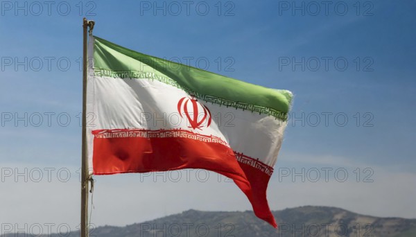 Flag, the national flag of Iran flutters in the wind