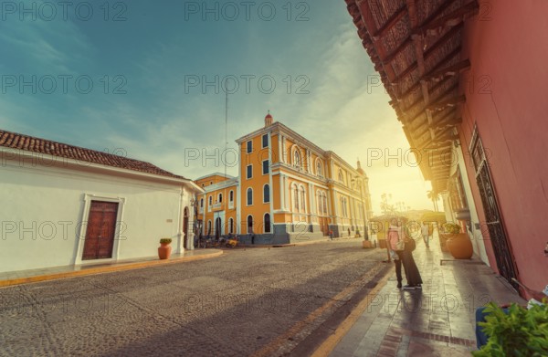 People walking through the cathedral of Granada that leads to La Calzada street. Granada, Nicaragua. 05-10-2024