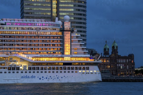 Cruise ship Aida Prima at the Cruise Terminal of Rotterdam, Kop van Zuid, skyscrapers at the Wilhelminakade, Hotel New York building, Netherlands