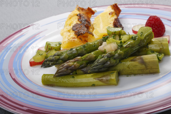 South German cuisine, green asparagus with rhubarb vinaigrette and potato gratin, healthy, vegetables, plated, vegetarian, traditional cuisine reinterpreted, food photography, studio, Germany, Europe