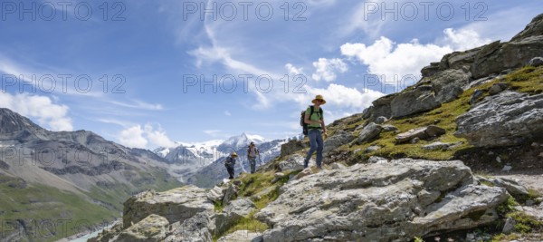 Two mountaineers on a hiking trail, behind mountain peak Mont Blanc de Cheilon, Hérménence, Valais Alps, Valais, Switzerland, Europe