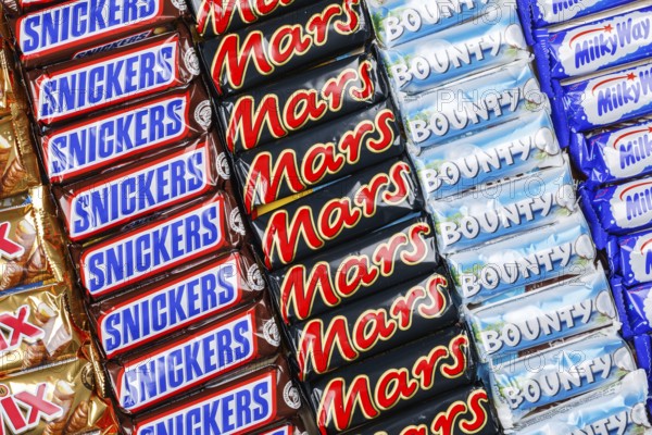 Mars Incorporated products such as Snickers chocolate bars, Twix, Milky Way and Bounty bars as a background