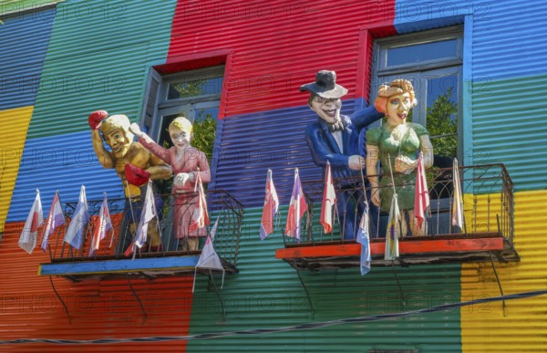 La Boca, Buenos Aires, Argentina, colourfully painted houses in the harbour district around the El Caminito alley. Figures of Argentinian personalities greet you on a balcony above a shop. La Boca emerged at the end of the 19th century as a neighbourhood of Italian immigrants, most of whom worked as industrial workers. Today, the working-class neighbourhood is popular with tourists, partly because of its original houses, often built from the sheet metal of scrapped ships and brightly painted with ship paint, South America