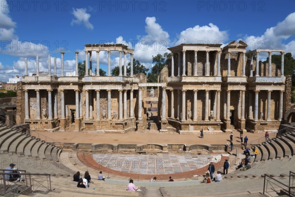 Large Roman theatre with impressive ancient columns and numerous spectators in the rows of seats under a blue sky, Teatro Romano de Mérida, Roman theatre of Merida, Merida, Badajoz, Extremadura, Spain, UNESCO World Heritage Site, Europe