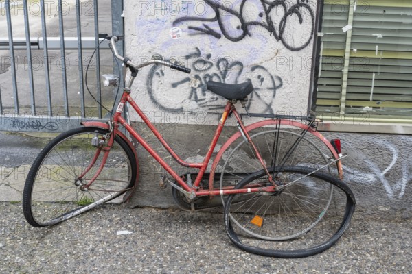 A completely destroyed and demolished bicycle parked against a house wall, Baden-Württemberg, Germany, Europe