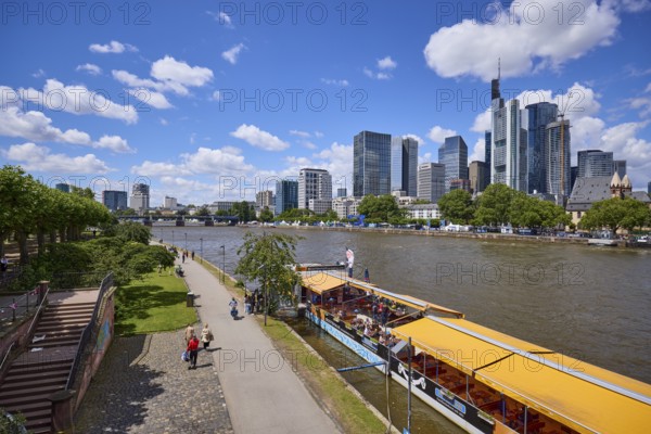 Riverside promenade on the Main with high-rise buildings and Untermainbrücke bridge in Frankfurt am Main, Hesse, Germany, Europe