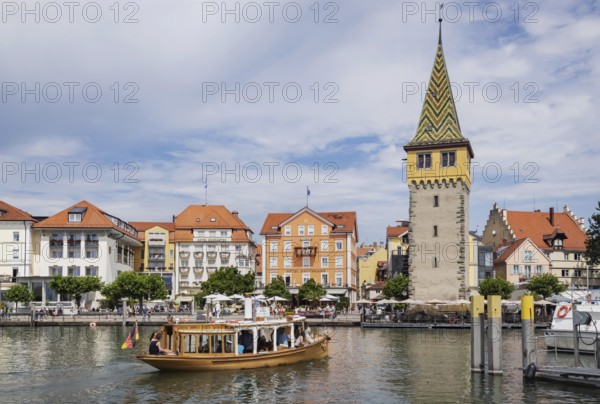 Harbour of Lindau, town view with man tower from excursion boat. Lindau, Lake Constance, Bavaria, Germany, Europe