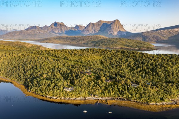 Aerial view over the fjord Efjord south of Narvik, seen at sunset, leisure boats anchor, holiday huts, calm sea, Norway, Europe