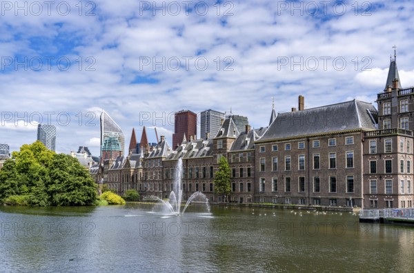 The historic Binnenhof, seat of the Dutch government, Hofvijver pond, skyline of the city centre at the central station, in the city centre of The Hague, Netherlands