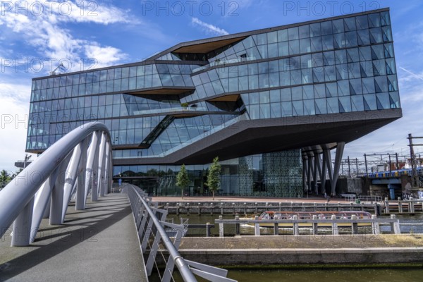 New corporate headquarters of Booking.com, online travel agency, hotel broker, building at Oosterdokseiland in the city centre of Amsterdam, Netherlands