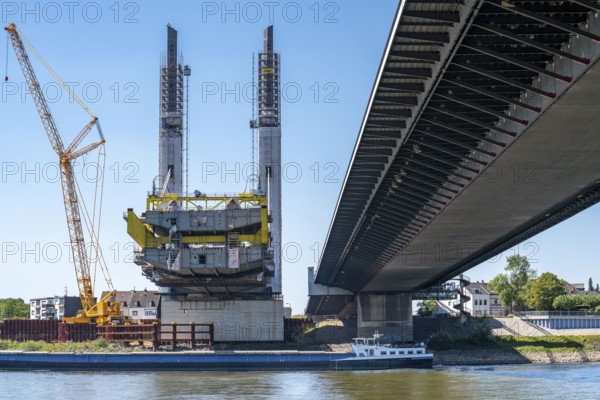 New construction of the Neuenkamp motorway bridge on the A40, over the Rhine near Duisburg, cantilever erection of the main bridge span, the new bridge is being built parallel to the existing bridge, the old one demolished and a second one built, North Rhine-Westphalia, Germany, Europe