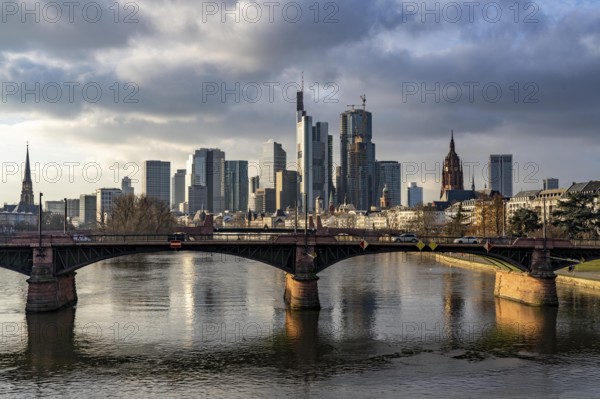 Skyline of the city centre of Frankfurt am Main, river Main, Ignatz-Bubis-Bridge, dusk, Hesse, Germany, Europe