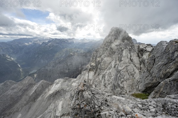 Clouds around a narrow rocky ridge, Watzmann crossing to Watzmann Mittelspitze, view of mountain panorama, Berchtesgaden National Park, Berchtesgaden Alps, Bavaria, Germany, Europe