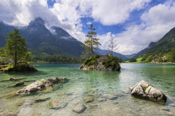 Hintersee near Ramsau with clear green water, surrounded by forests and mountains under a cloudy sky, Berchtesgaden National Park, Berchtesgadener Land, Upper Bavaria, Bavaria, Germany, Europe