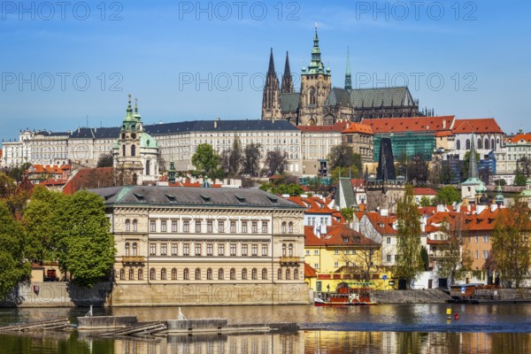 View of Charles bridge over Vltava river and Gradchany Prague Castle and St. Vitus Cathedral