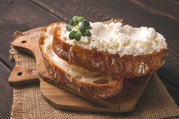 Sandwich, with cream cheese, homemade, on a cutting board, rustic style, no people, selective focus, breakfast