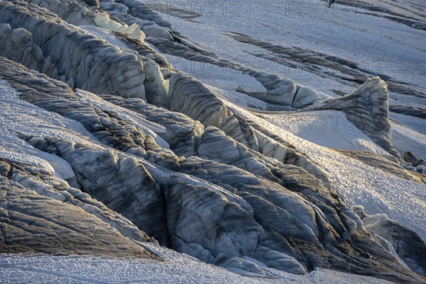 Glacier ice with crevasses in the evening light, Glacier du Tour at sunset, High alpine mountain landscape, Chamonix, Haute-Savoie, France, Europe