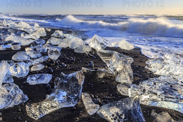 Ice floes on the beach, waves, sea, sunny, morning light, winter, Diamond Beach, Breidamerkursandur, Jökulsarlon, IcelandIce floes on the beach, waves, sea, sunny, evening light, winter, Diamond Beach, Breidamerkursandur, Jökulsarlon, Iceland, Europe