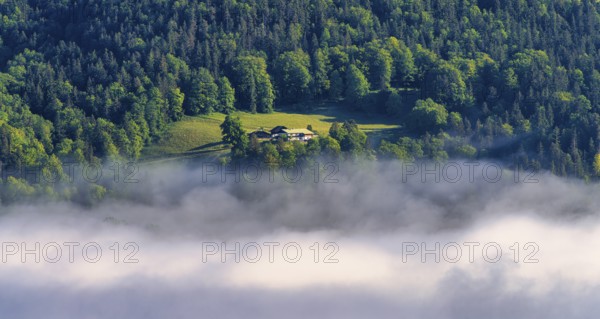 Morning fog over the village of Berchtesgaden in the valley, Bavaria, Germany, Europe