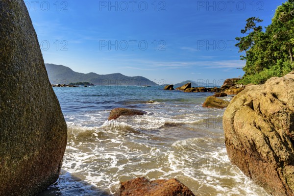 The sea between the stones of Bonete beach on the island of Ilhabela, Bonete beach, Ilhabela, Sao Paulo, Brazil, South America