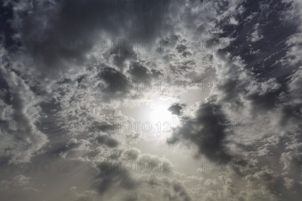 Sun shining through dark clouds, cloudy sky, Granada, Andalusia, Spain, Europe