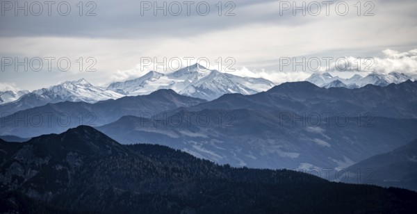 View of the Alpine foothills and the main Alpine ridge with snow-covered peaks, from the Austrian Schinder, Bavarian Alps, Mangfall mountains, Bavaria, Germany, Europe