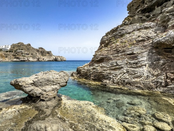 View of the turquoise blue bay of Agios Pavlos in the background on the Libyan Sea Mediterranean in front rocks in the shape of a mushroom, Agios Pavlos, Crete, Greece, Europe