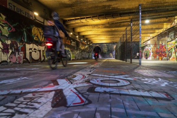 The Nordbahntrasse, a cycle path, footpath, on a former 22 km long railway line, along the west-east axis of Wuppertal, on the northern slope, with many tunnels, viaducts and views of the city, graffiti and basketball area at Brill, Wuppertal, North Rhine-Westphalia, Germany, Europe