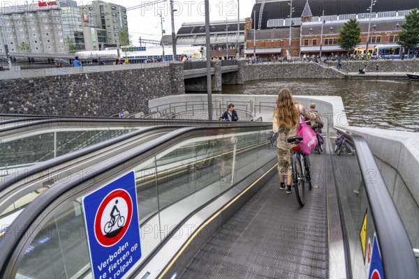 New bicycle car park at Amsterdam Central Station, Stationsplein, space for around 7000 bicycles, largest in Amsterdam, digitally monitored, underground, direct connection to the station and metro, Netherlands, escalators lead to the bicycle garage, Netherlands