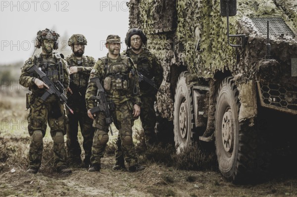 Armed soldiers, photographed as part of a Bundeswehr exercise with armed forces from Norway and the Czech Republic during the 'Wettiner Schwert' exercise as part of Quadriga 2024 in the training town of Schnöggersburg, 8 April 2024