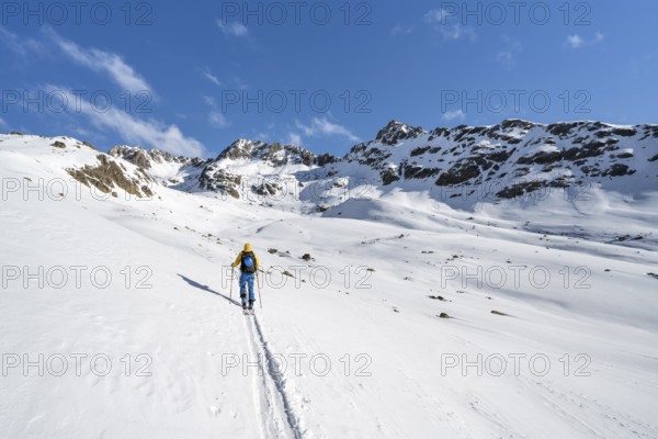 Ski tourers in a wintry mountain landscape, Bündner Haute Route ski tour, Albula Alps, Rhaetian Alps, Grisons, Eastern Switzerland, Switzerland, Europe