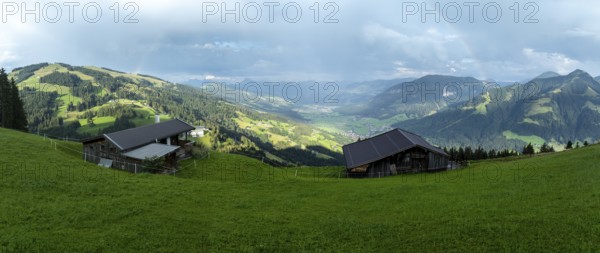 Alpine huts, view over the Brixen Valley with rainbow, Hochbrixen, Brixen im Thale, Kitzbühel Alps, Tyrol, Austria, Europe