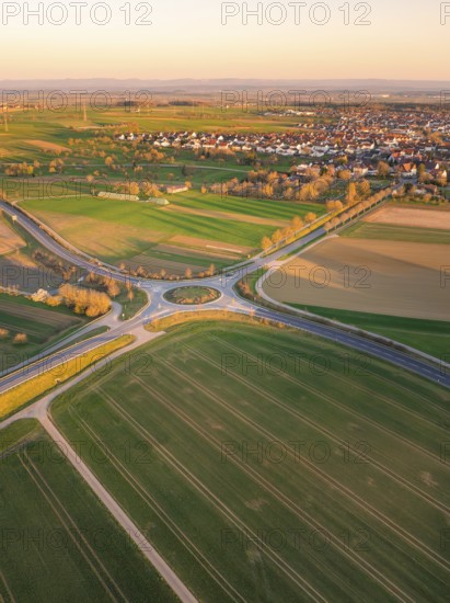 Aerial view of fields and roads in the morning light with a village in the background, Nagold, Black Forest, Germany, Europe