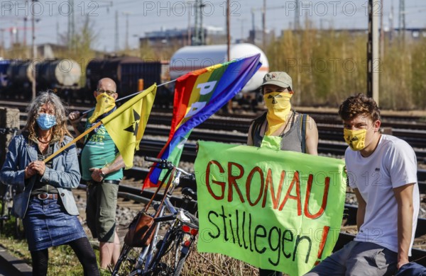 Münster, North Rhine-Westphalia, Germany - Anti-nuclear demonstration in times of the corona crisis in compliance with the protection rules with distance and mouth protection, nuclear opponents demonstrate at Münster freight station against the Castor transport from Gronau, against the uranium waste transport from the uranium enrichment plant Gronau to the Russian nuclear factory Novouralsk