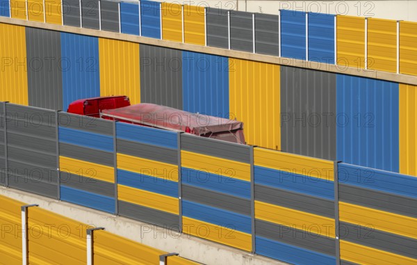 Colourful noise barriers on the A52 motorway, at the Essen-Rüttenscheid junction, the noise barriers were rebuilt in a colourful design as part of the motorway renovation, North Rhine-Westphalia, Germany, Europe