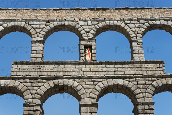 Close-up of a stone aqueduct with several arches under a clear blue sky in Segovia, Aqueduct, Segovia, Castilla y León, Leon, Spain, Europe