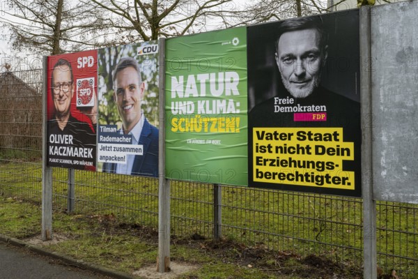 Board with election posters, SPD, CDU, Bündnis90 Die Grünen, FDP, Bundestag election 2025, Kamen, North Rhine-Westphalia, Germany, Europe