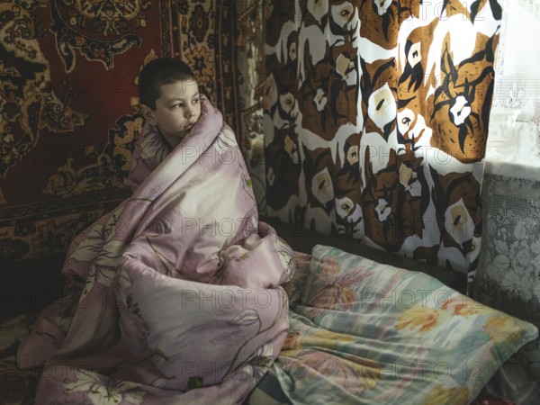 Like his mother Tanya, Nasar (10) is deaf and traumatised by the nearby war. Tanya wants to leave the frontline region with him and her daughter Polja. But she has no passports for herself and the children, Voloska Balakliia, Ukraine, Europe
