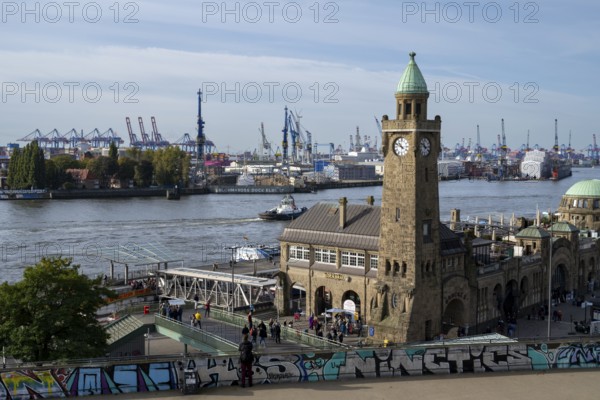 Clock tower, Landungsbrücken, harbour cranes in the harbour behind, St. Pauli, Hamburg, Germany, Europe