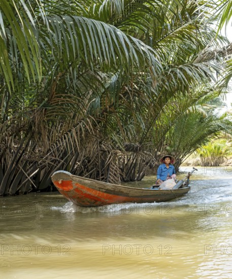 Vietnamese Woman ina rowing boat, Mekong Delta, Vietnam, Asia