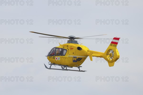 The ÖAMTC rescue helicopter Christophorus 3 of the type Eurocopter 135, air rescue, flying, Lake Neusiedl National Park, Burgenland, Austria, Europe