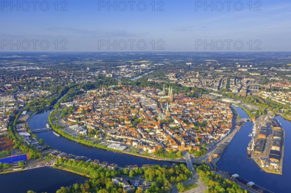 Aerial view over the river Trave and church towers in the old town of the Hanseatic City of Lübeck in spring, Schleswig-Holstein, Germany, Europe