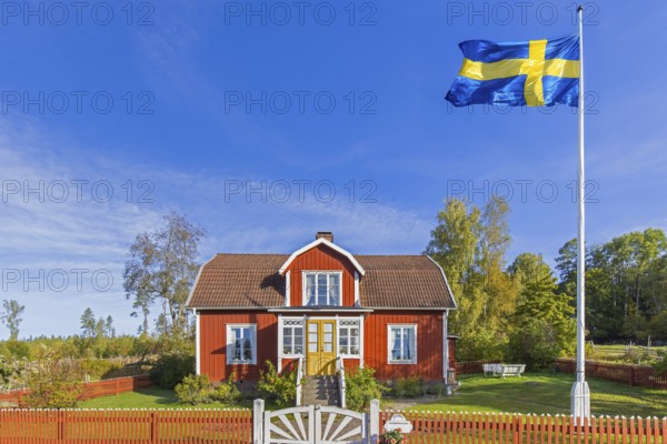 Katthult, red wooden farm house with fence from Astrid Lindgren's tales about Emil of Lönneberga at Gibberyd near Rumskulla, Vimmerby, Småland, Sweden, Europe