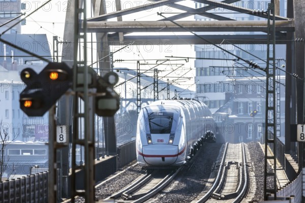 ICE en route on a railway bridge with tracks and signalling system. Mannheim, Baden-Württemberg, Germany, Europe