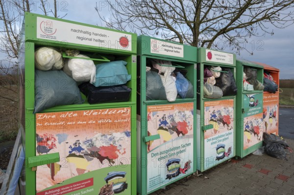 Overfilled clothes containers in a car park, Eckental, Middle Franconia, Bavaria, Germany, Europe