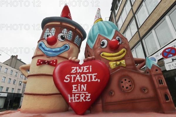 Ironic themed float on the rivalry between Düsseldorf and Cologne, city friendship, castle tower and church made of papier-mâché, Rose Monday parade Düsseldorf, North Rhine-Westphalia, Germany, Europe