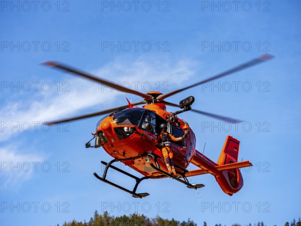 On-board mechanic of the rescue helicopter Christoph 14 winching with the cable winch, Bad Reichenhall, Berchtesgadener Land, Upper Bavaria, Bavaria, Germany, Europe
