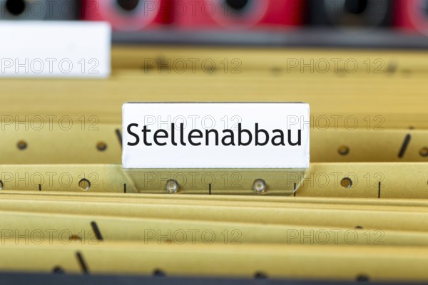 Sign with the inscription STELLENABBAU on a suspension file folder (symbolic image)